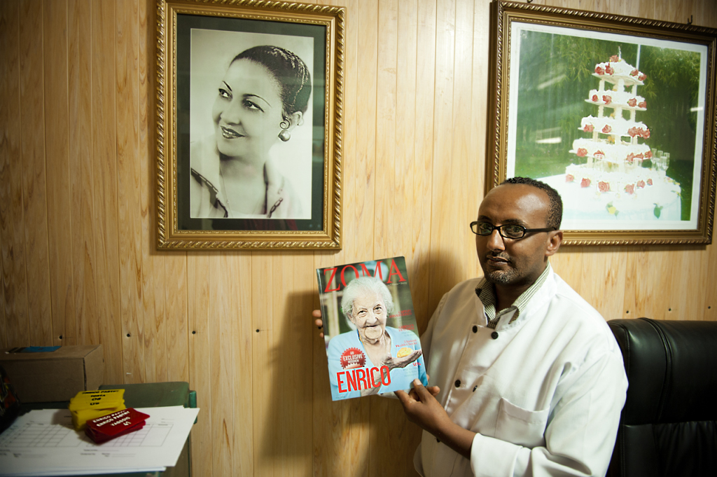 Enrico' pastry shop manager shows a magazine cover dedicated to the wife of the famous Italian pastry master, who died recently after 50 years spent in making the