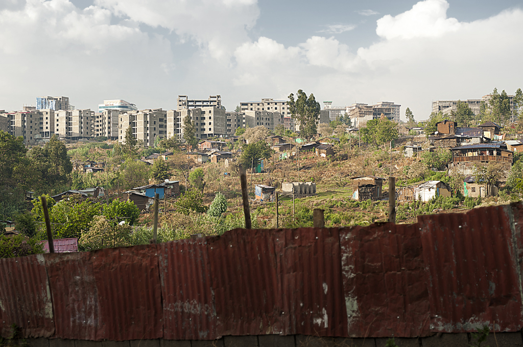 Informal settlement cleared at Piassa. In the back the new condominiums. Government has built 170,000 new housing units just in Addis, and 205,000 more are planned in the next 2 years